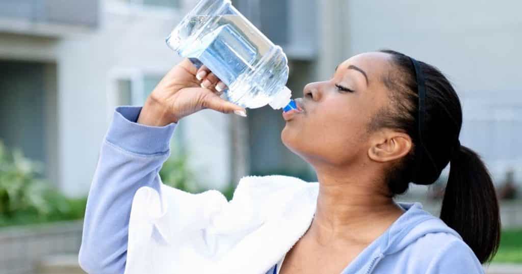 Person detoxing their body of THC by exercising and drinking water